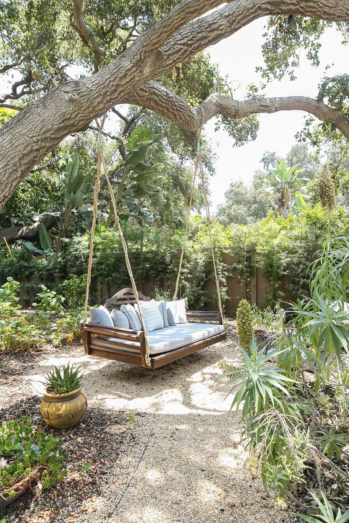 Swing bench in the garden is a great spot to rest in the garden