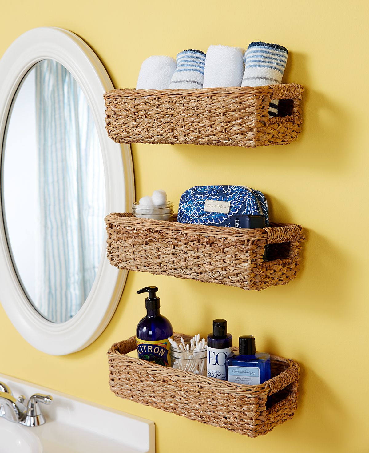 Three wicker baskets on the wall full of things