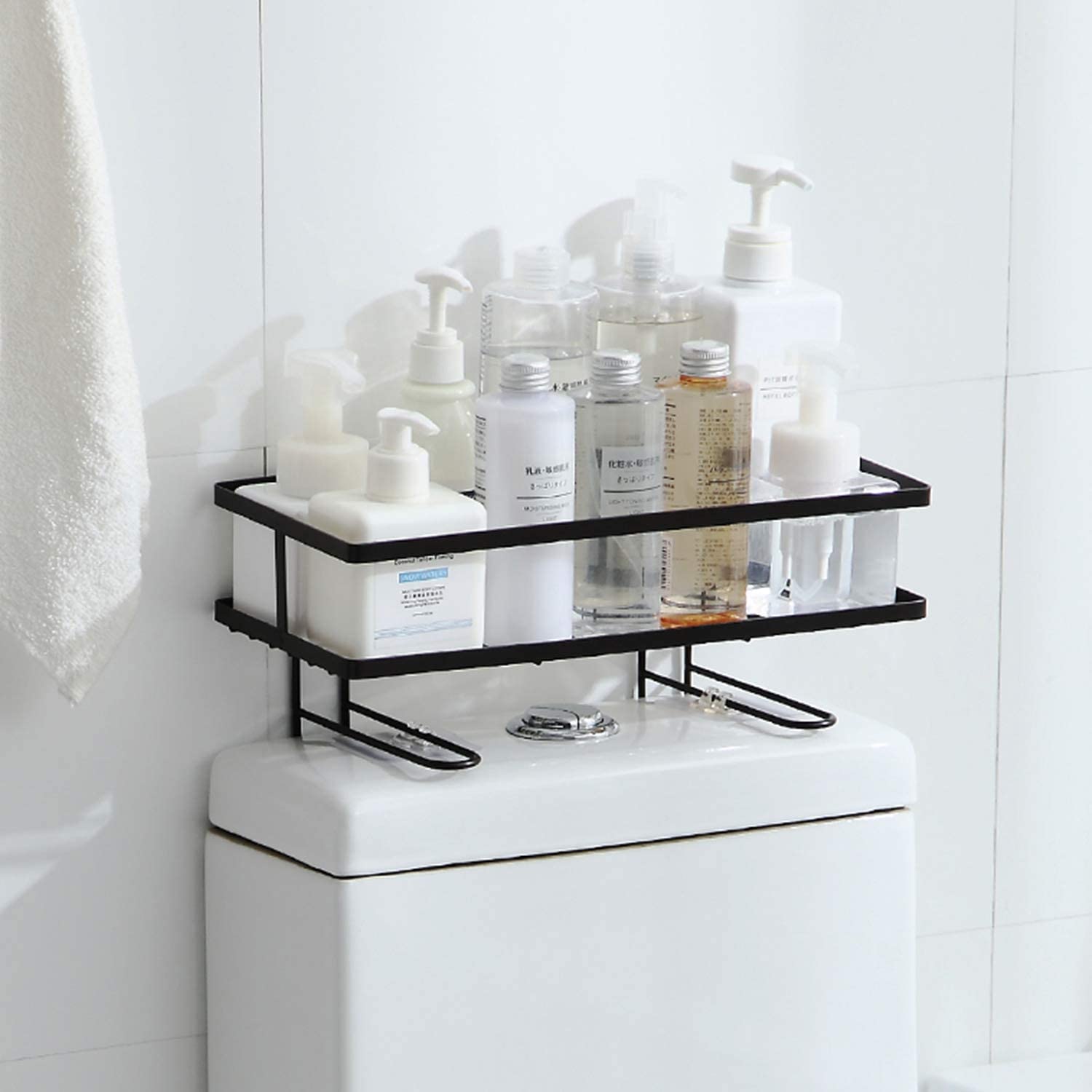 Toiletries in organizer rack placed on top of toilet