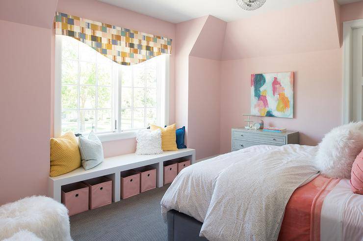 window seat bench with pink storage boxes bedroom bed blue yellow pillows