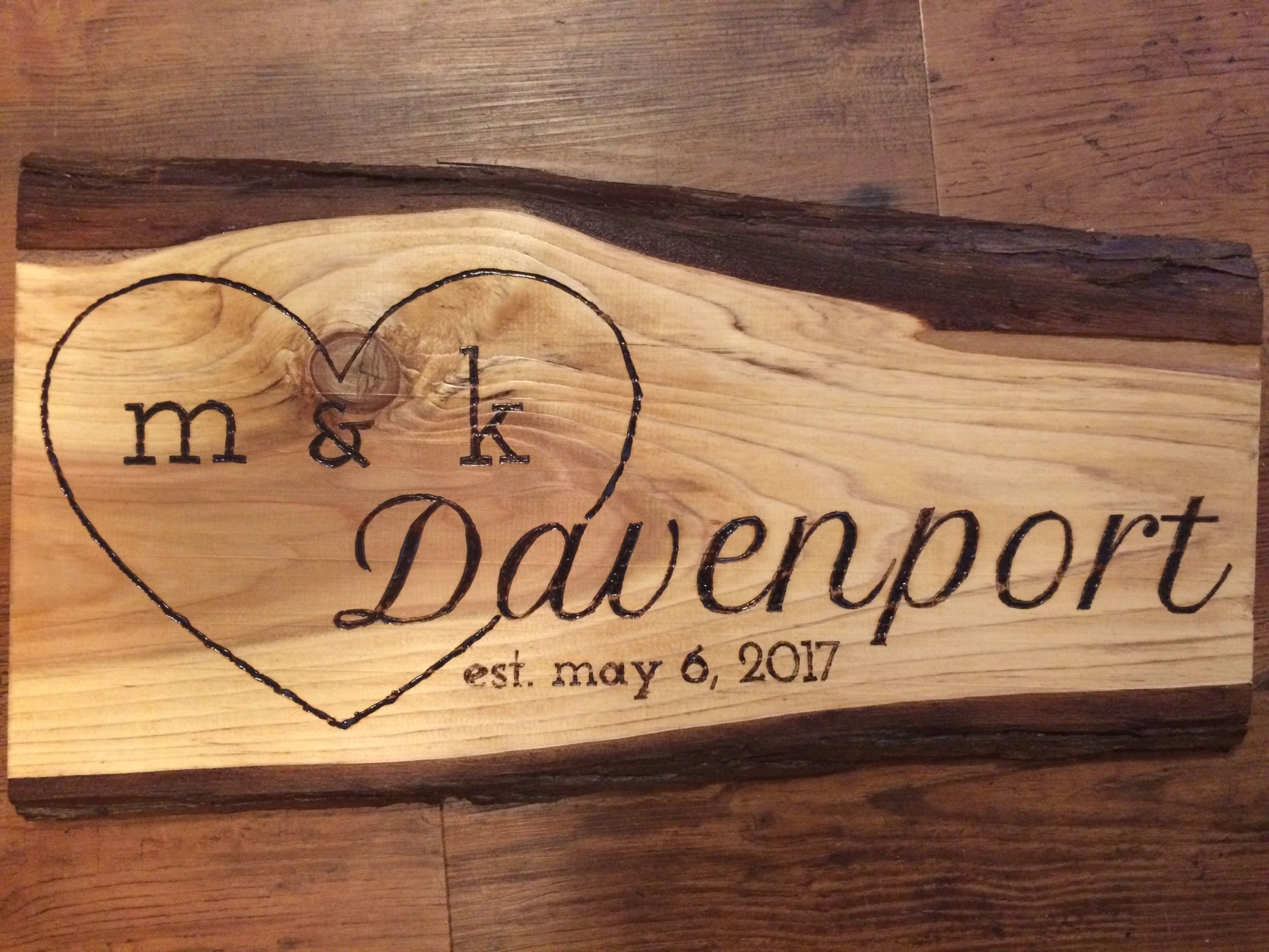 Wood wedding sign with a large heart
