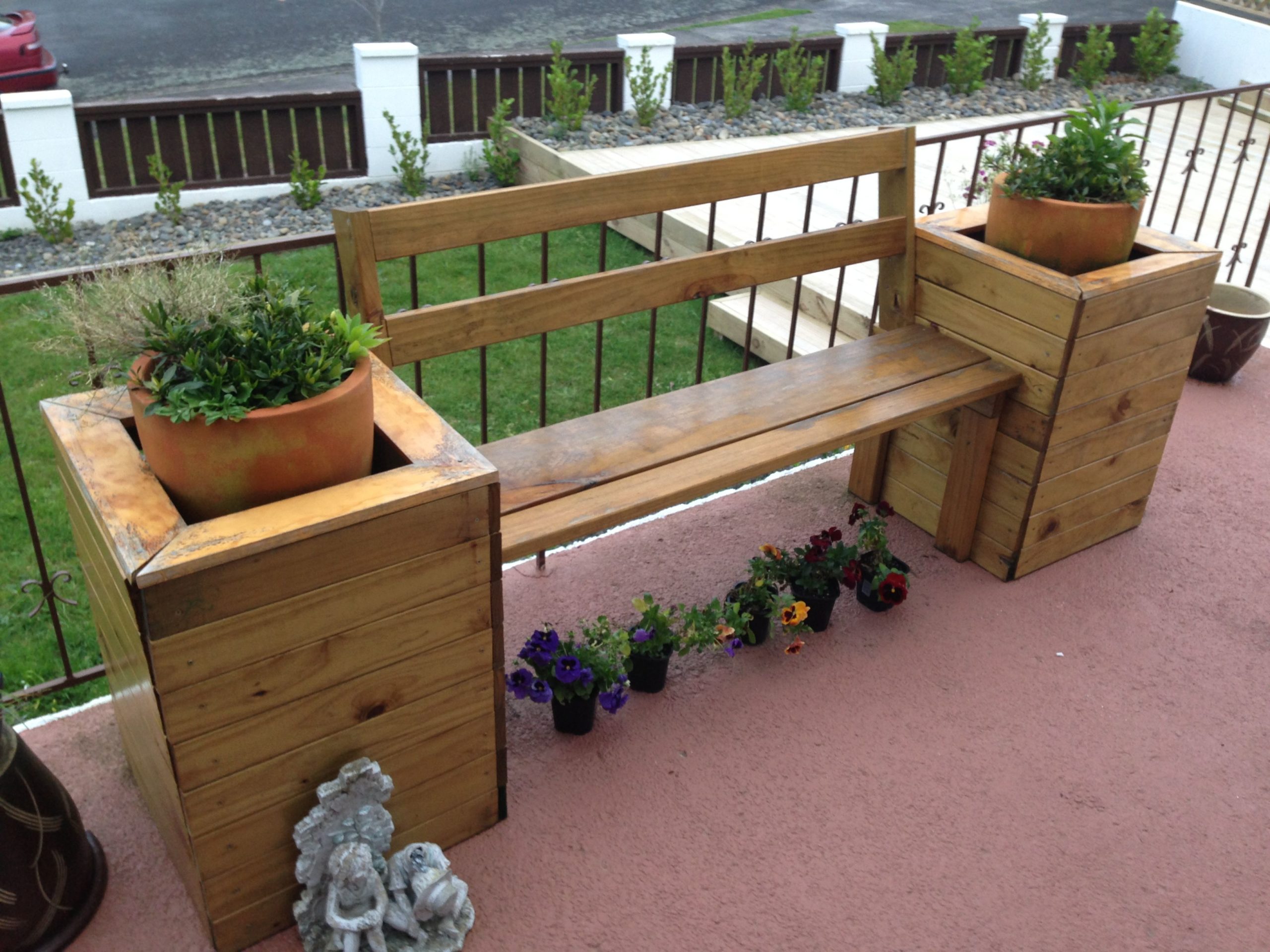 wooden bench with attached planter