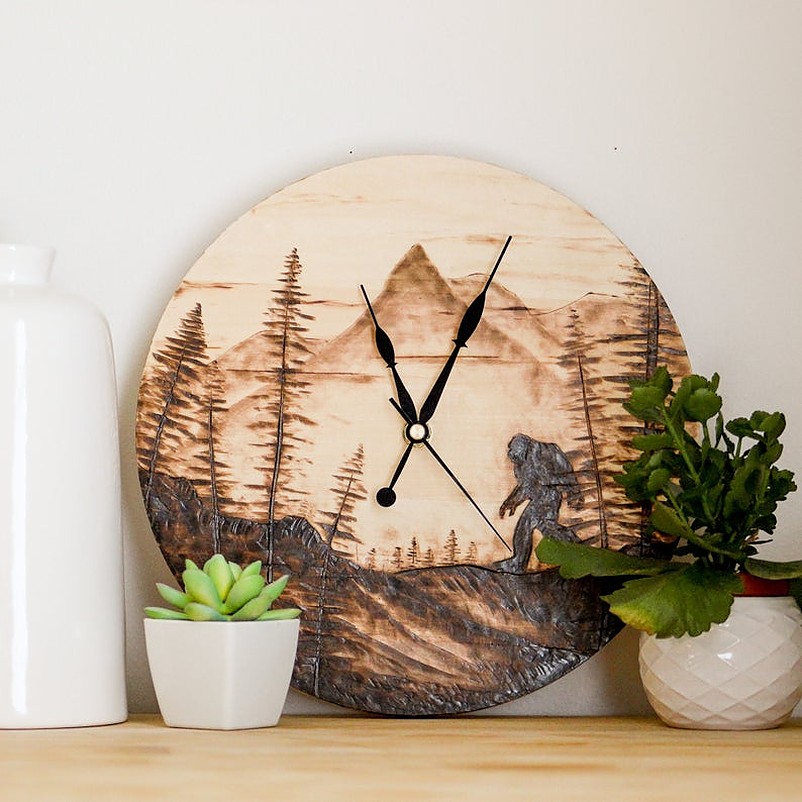 Wooden clock with two potted plants on white vase