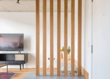 Wooden-slats-alongw-ith-custom-bench-in-the-living-room-also-offer-shoe-storage-space-for-the-entry-93776-217x155