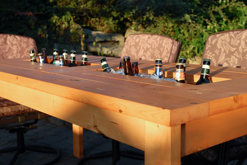 wooden table with built in drink storage