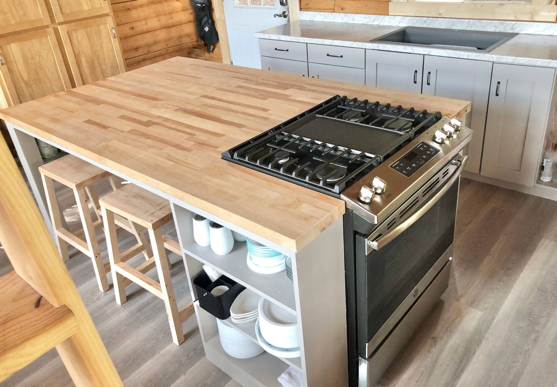 Wooden table with built-in cooking range