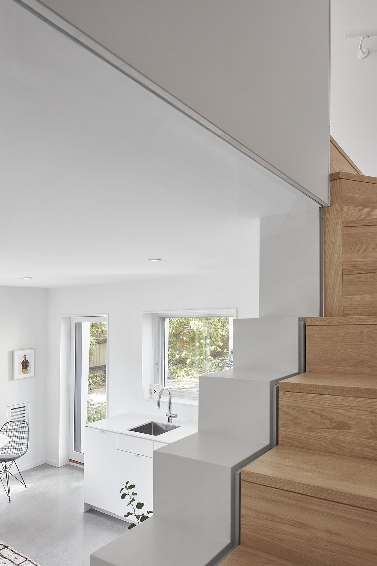 Woodsy staircase leads to the gorgeous upper level with bedrooms