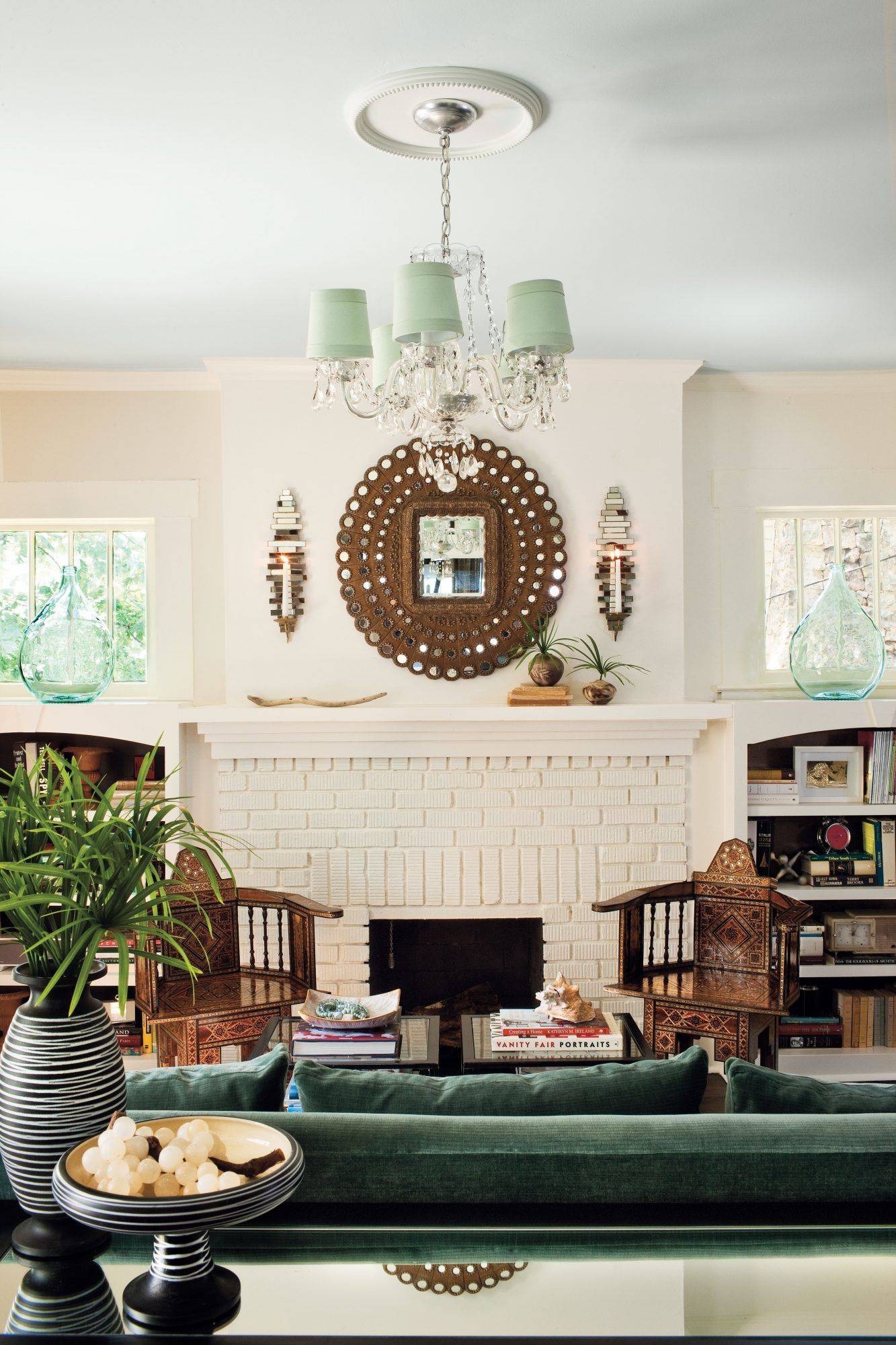 white painted brick fireplace with eclectic decor