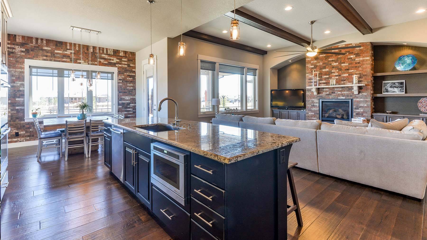 red brick fireplace in updated open floorplan