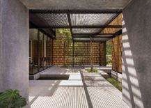 Custom-timber-screen-covering-the-facade-of-the-home-offers-ample-privacy-while-allowing-in-filtered-light-75014-217x155