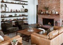red brick fireplace in living room with leather couches