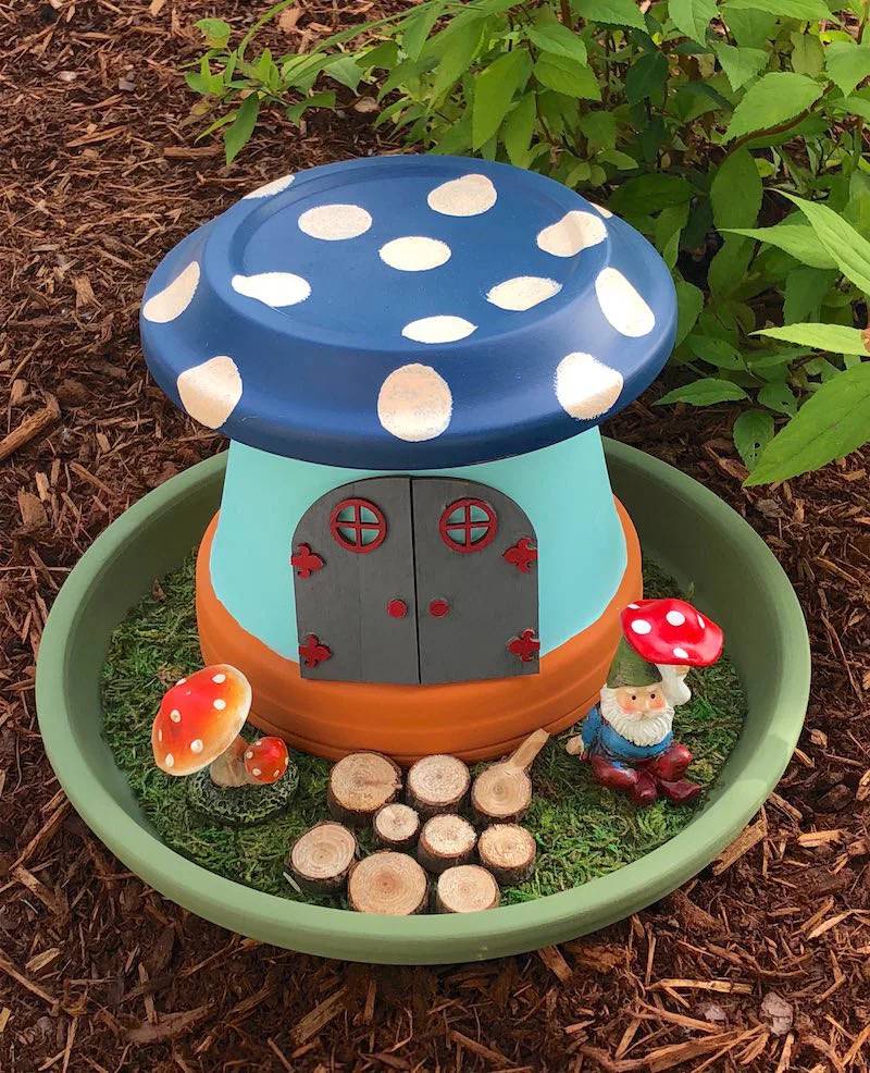 Gnome with a mushroom gnome house