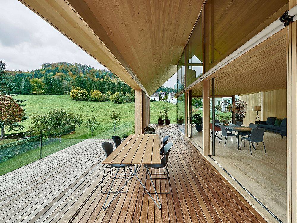 Gorgeous views of lush green landscape and distant hills from the wooden deck outside