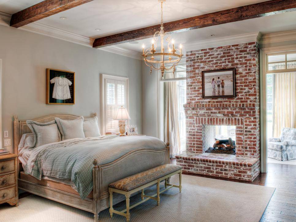 white washed brick fireplace in bedroom