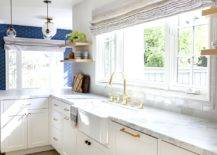 Kitchen sink with gold faucet