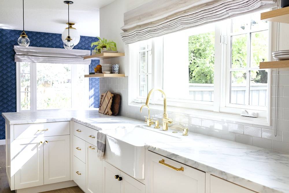 Kitchen sink with gold faucet