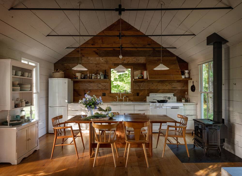 Light fixture hanging from ceiling above wooden table