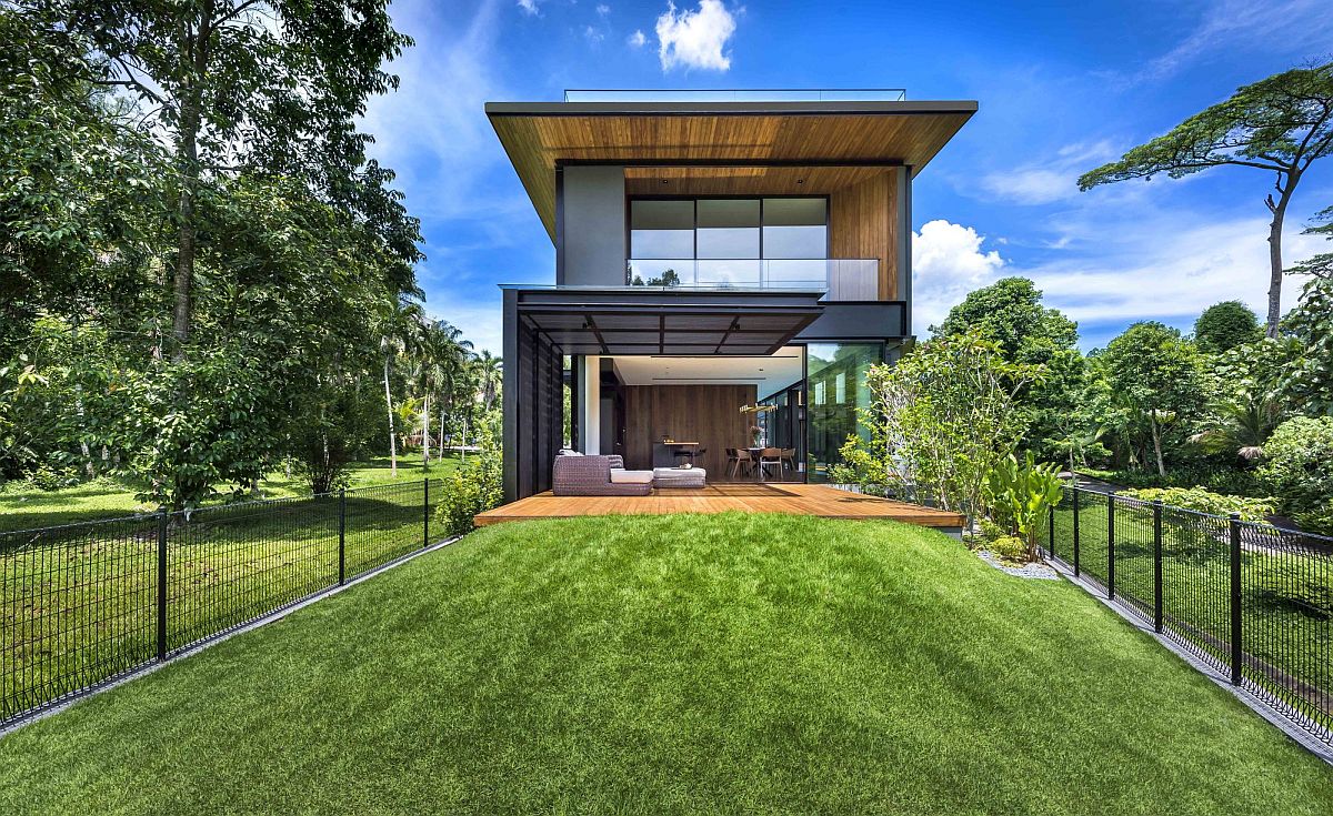 Lush green state land surrounds the rear section of the home