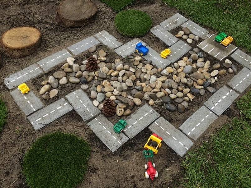 Makeshift car track with many toy cars