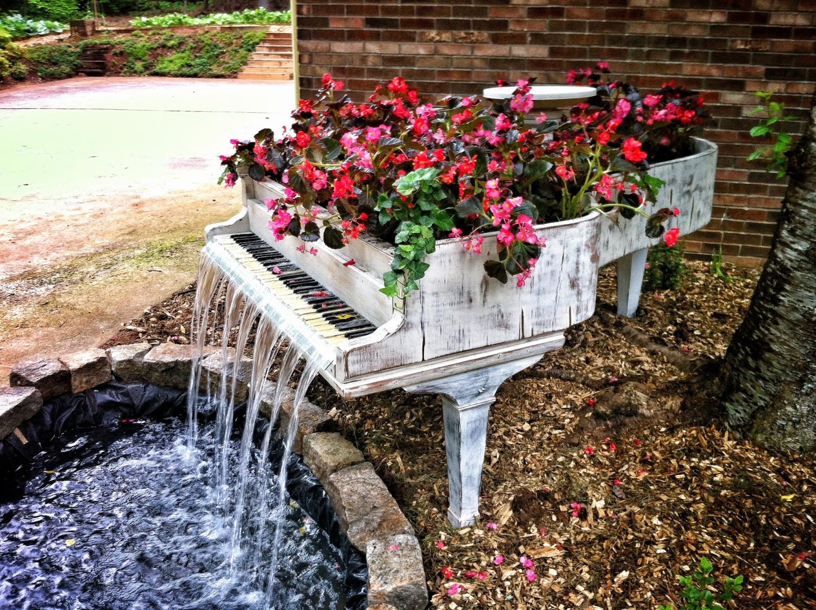 Piano waterfall acts as flowerbed