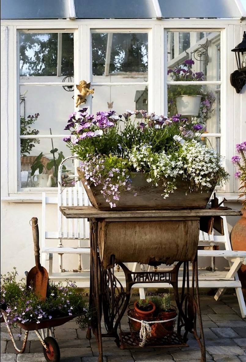 Planter on top of vintage sewing machine