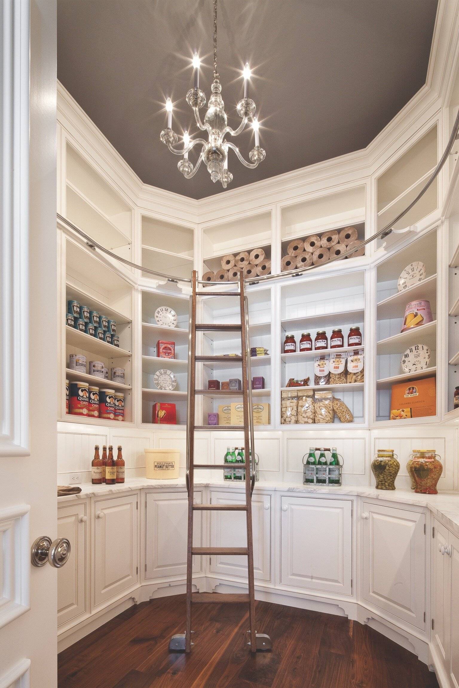Round pantry with ladder and chandelier