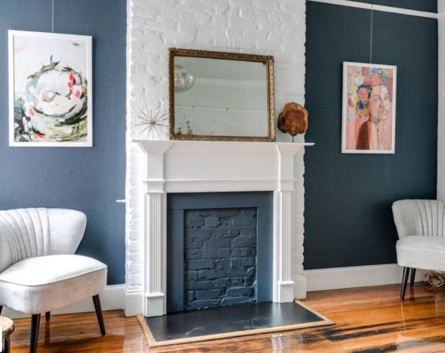 blue painted brick faux fireplace with white mantel