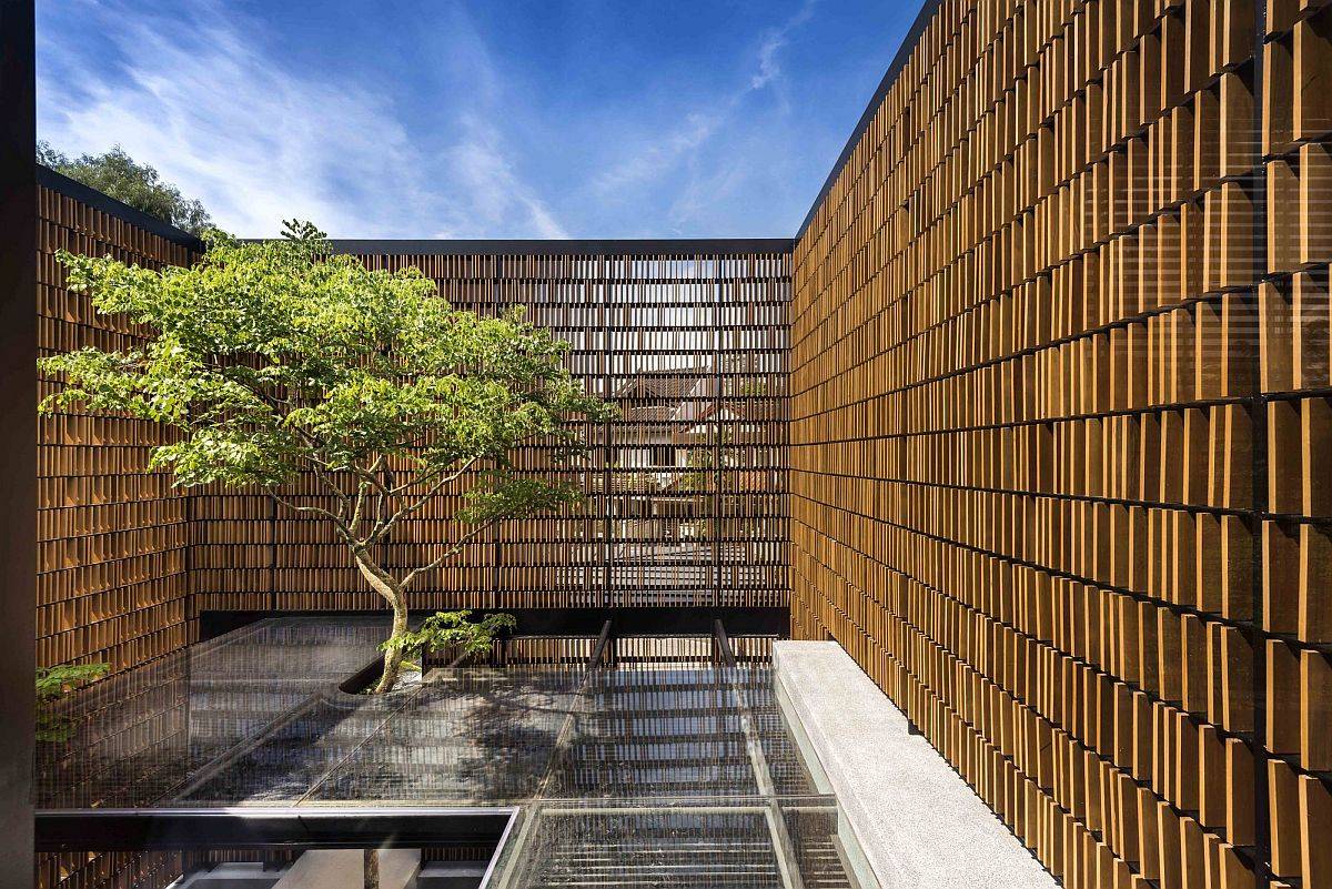 Sheltered and creative entrance of the urban home with a unique timber screen