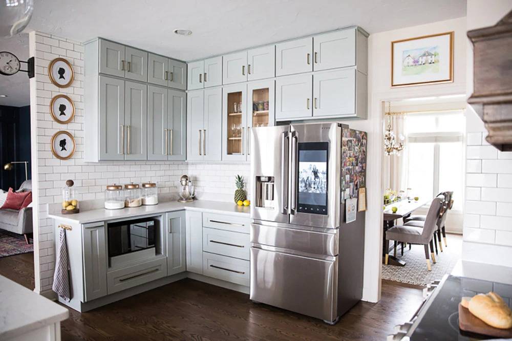 Small kitchen area with large fridge