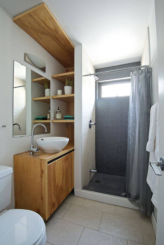 Tiny-bathroom-with-space-savvy-design-and-a-wooden-vanity-75296