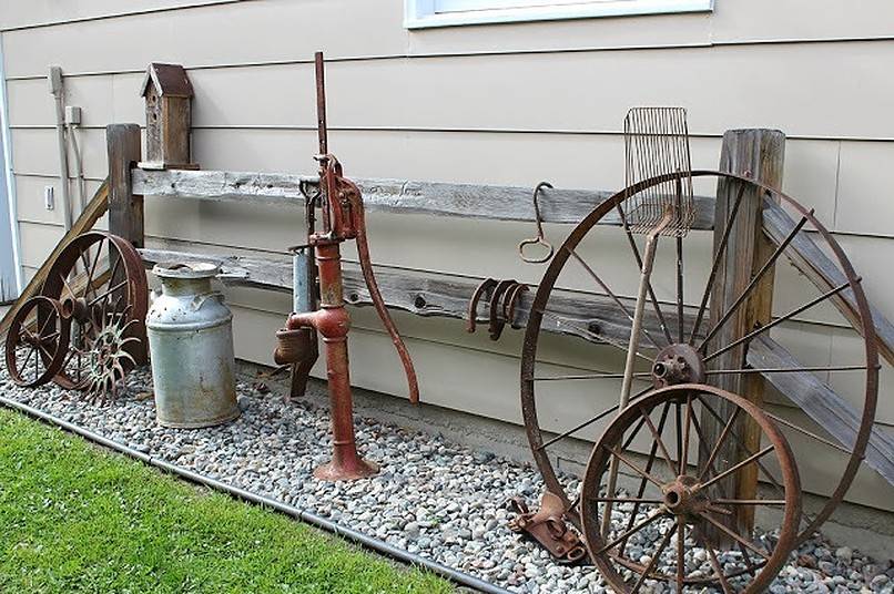 Vintage wheels, pump and jar on gravel
