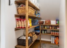 Walk-in pantry with wooden shelves
