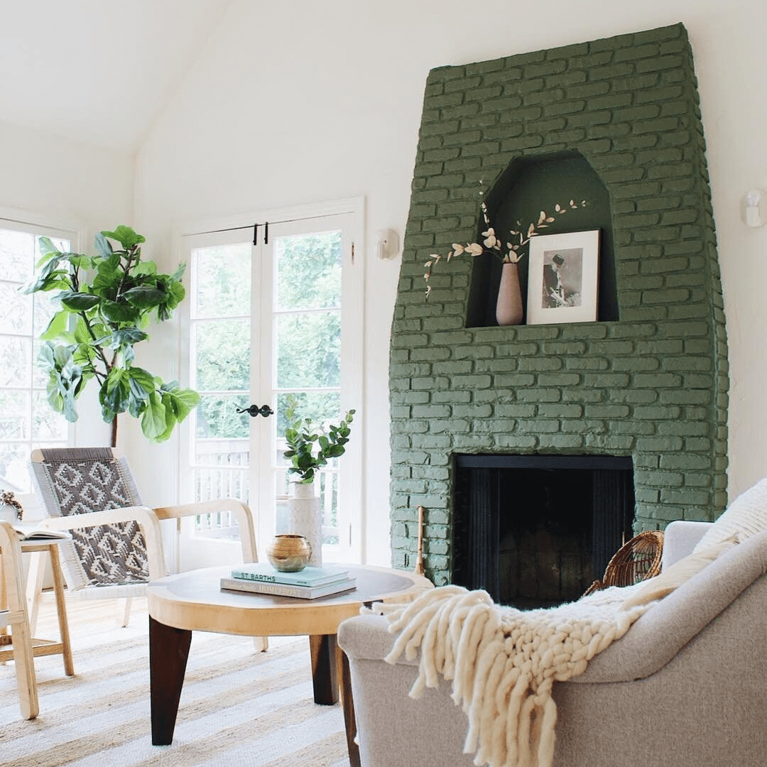 green painted brick in bright living room