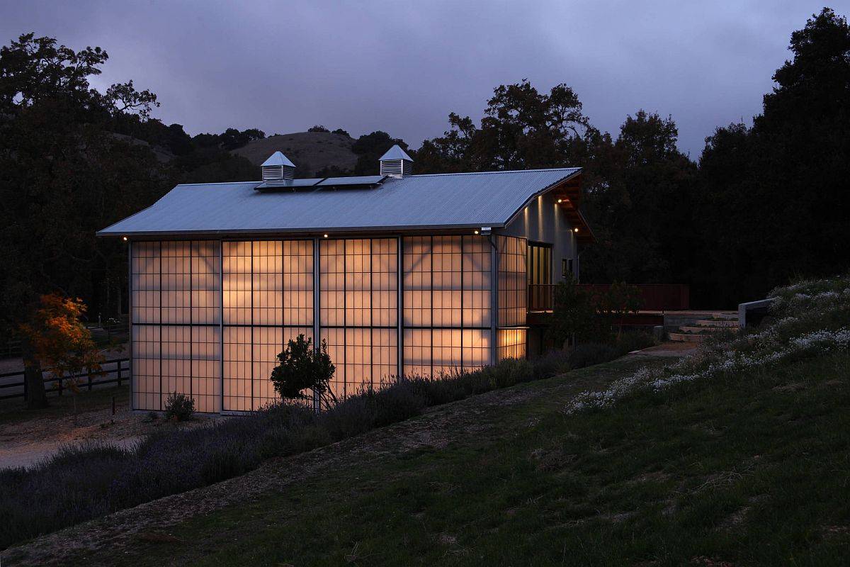 Barn style home with polycarbonate panels all around tha usher in natural light