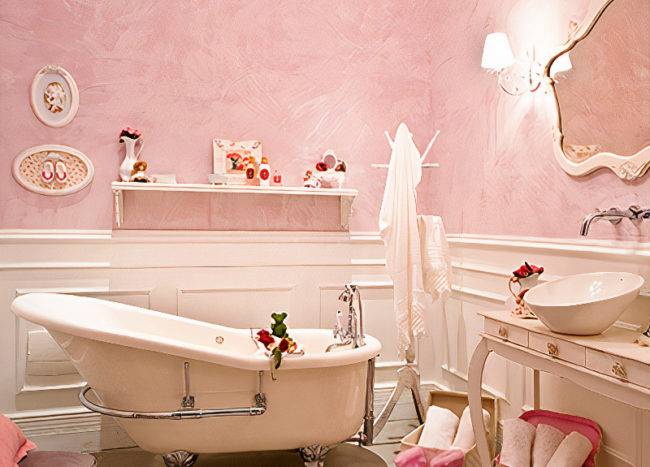 Bathroom with pink walls and white fixtures