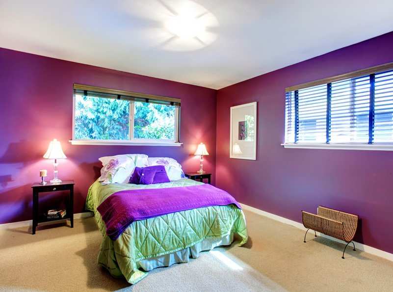 Bed with green and purple covers