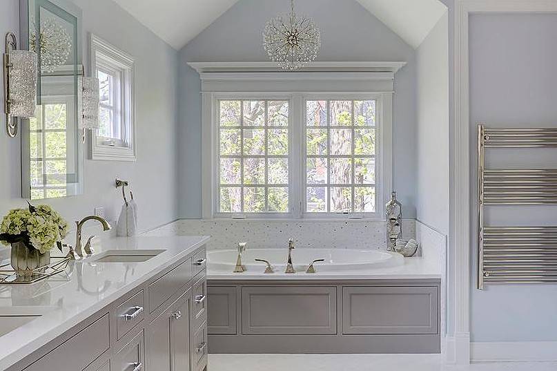 Blue and gray master bath color with round chandelier