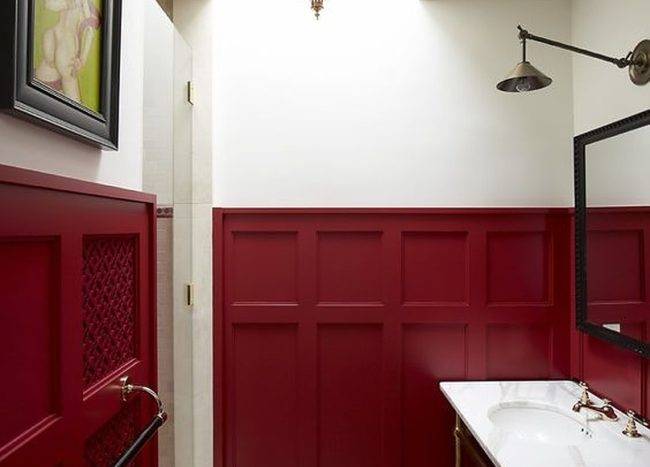 Burgundy wainscoting bathroom wall with marble sink