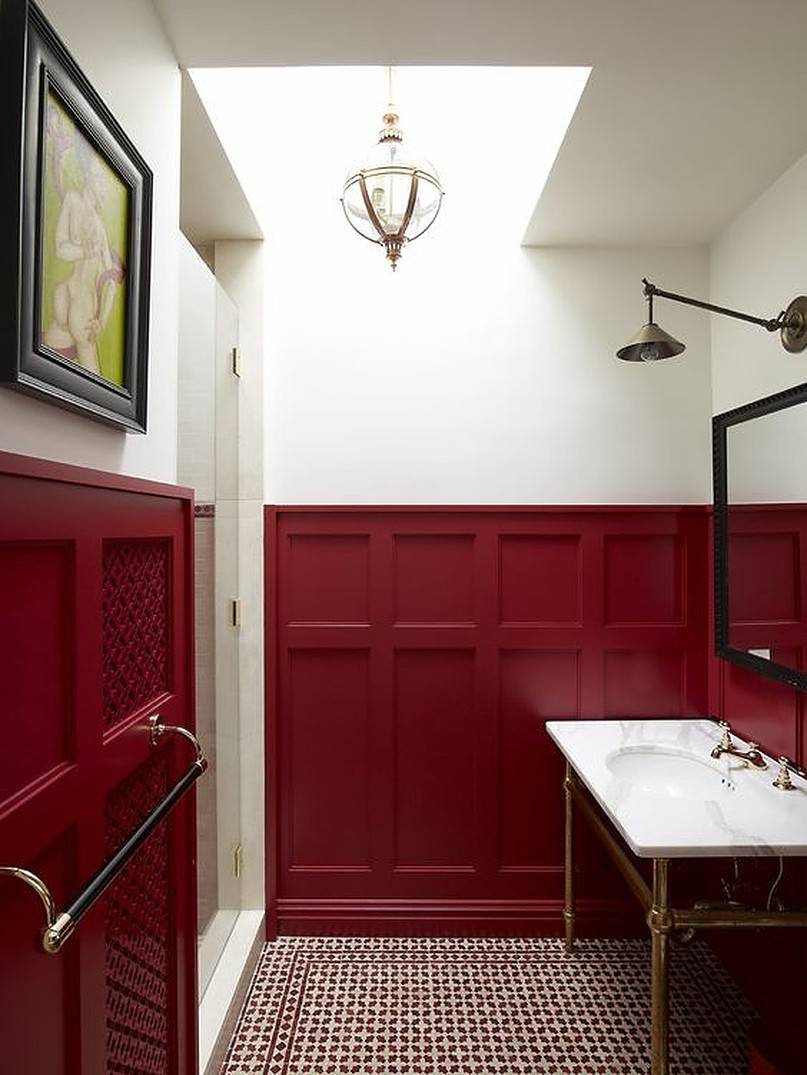 Burgundy wainscoting bathroom wall with marble sink