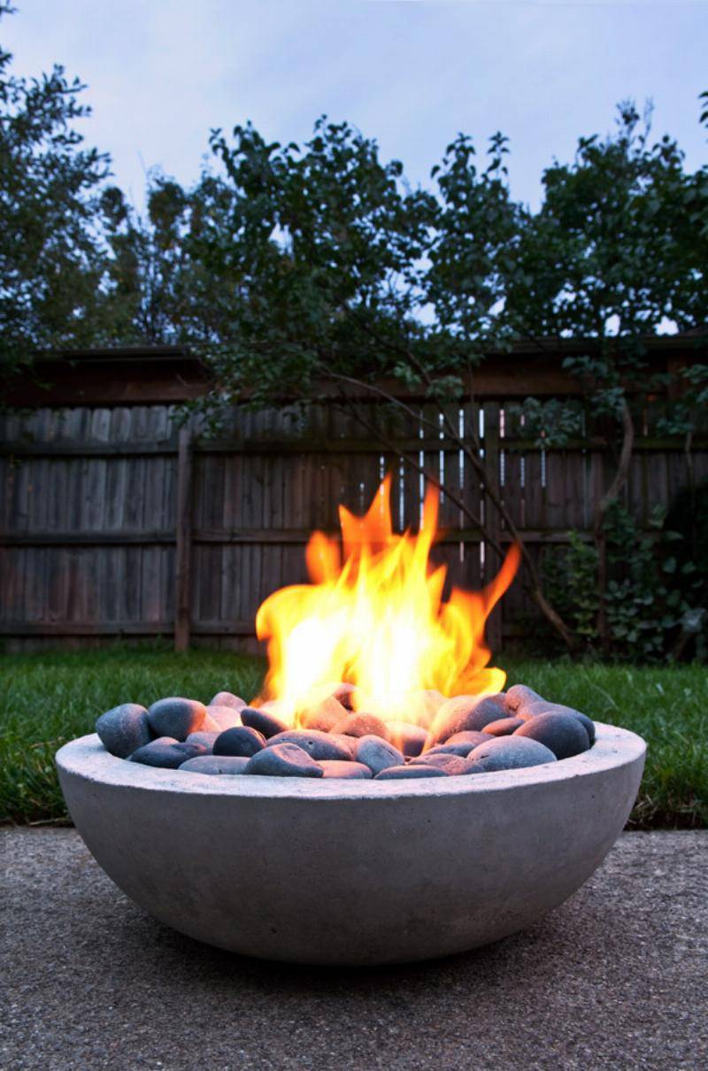 Concrete fire pit with burning fire