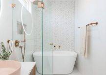 Fabulous-white-bathroom-with-herringbone-pattern-backdrop-and-penny-tile-floor-along-with-light-pastel-pink-sink-25107-217x155