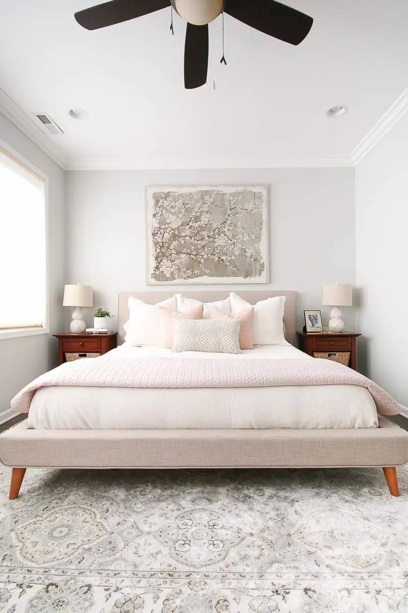 Grey painting above bed headboard