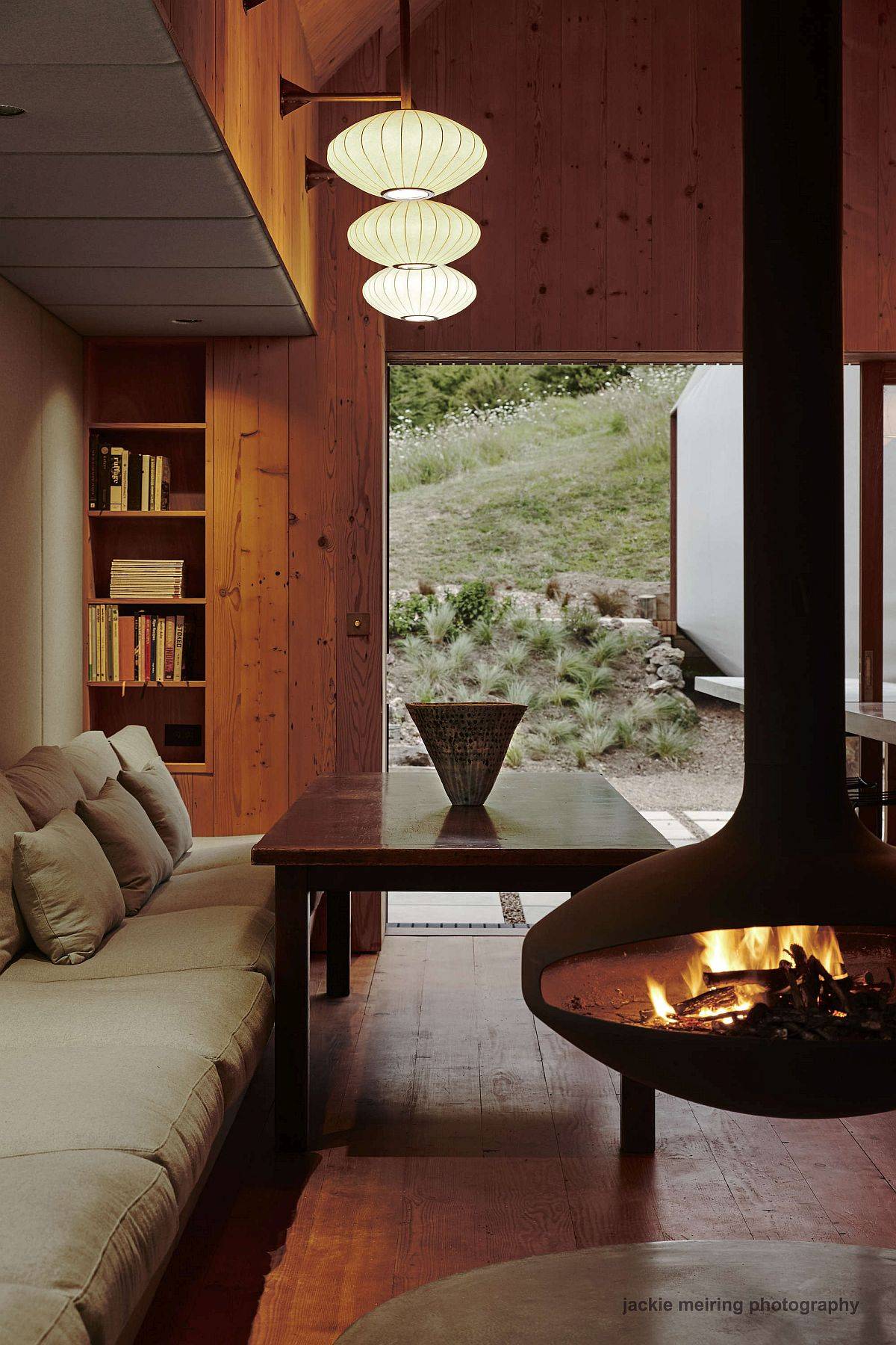 Living room of the home in the corner with a fabulous fireplace and custom lighting