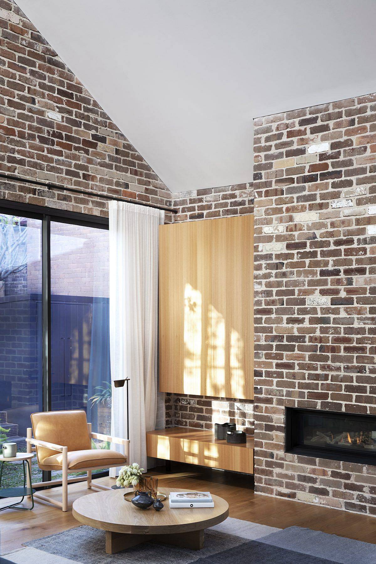 Lovely brick walls coupled with modern finishes and wooden sections inside the Cnr Virginia home