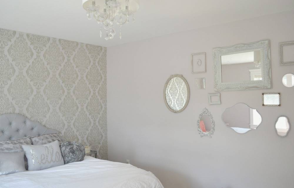 Mirrors hanging on grey bedroom wall