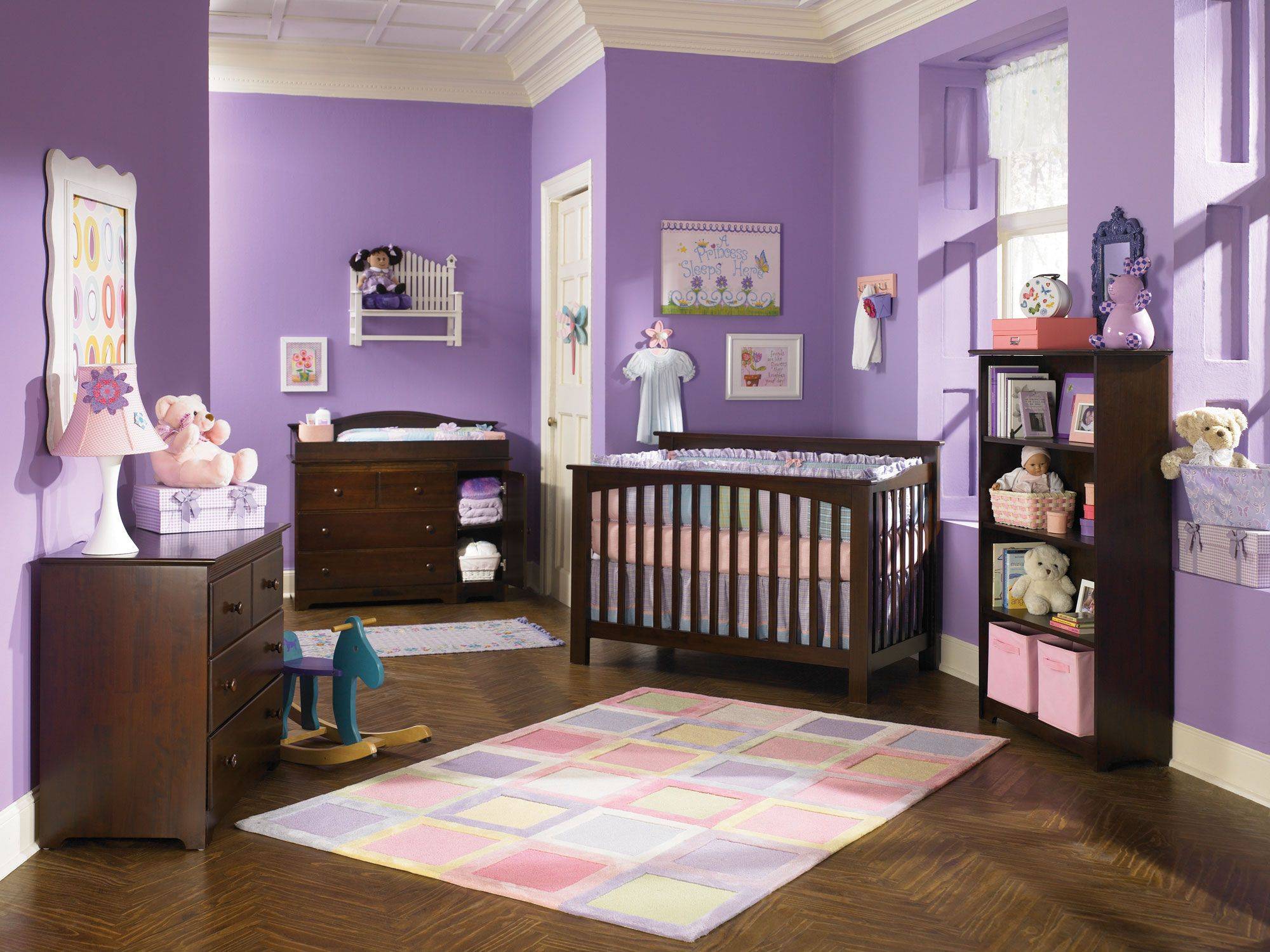 Nursery with purple wall and brown furnitures