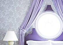 Purple bed with purple drapery