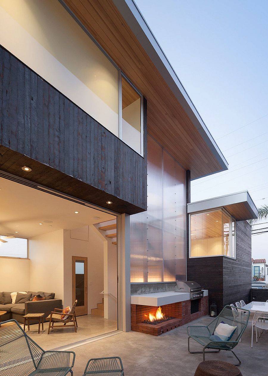 Rear facade of the spacious contemporary home covered with polycarbonate panels