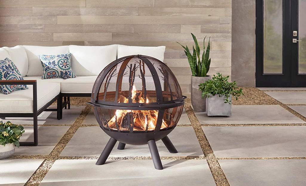 Round wood burning metal fire pit