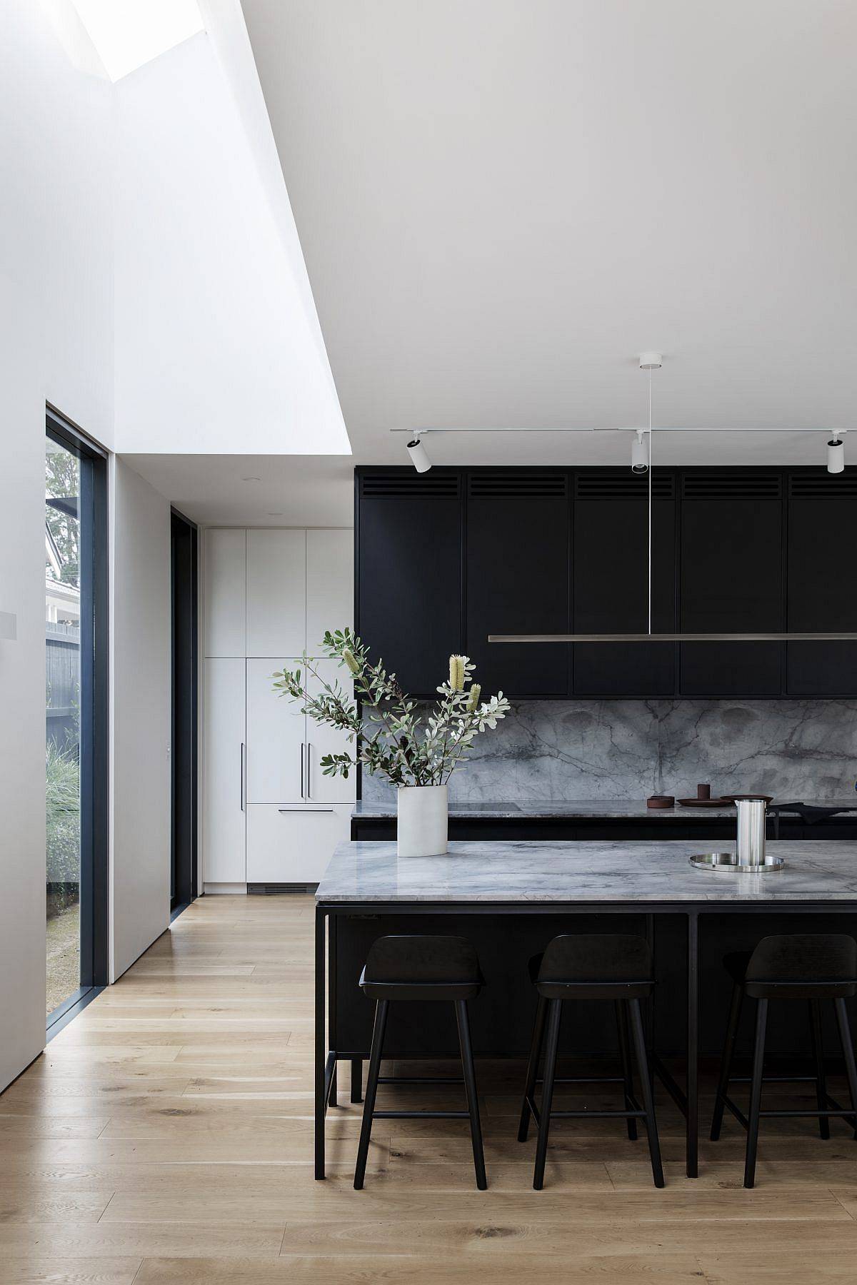 Skylight brings natural light into the modern kitchen of the Federation-era home